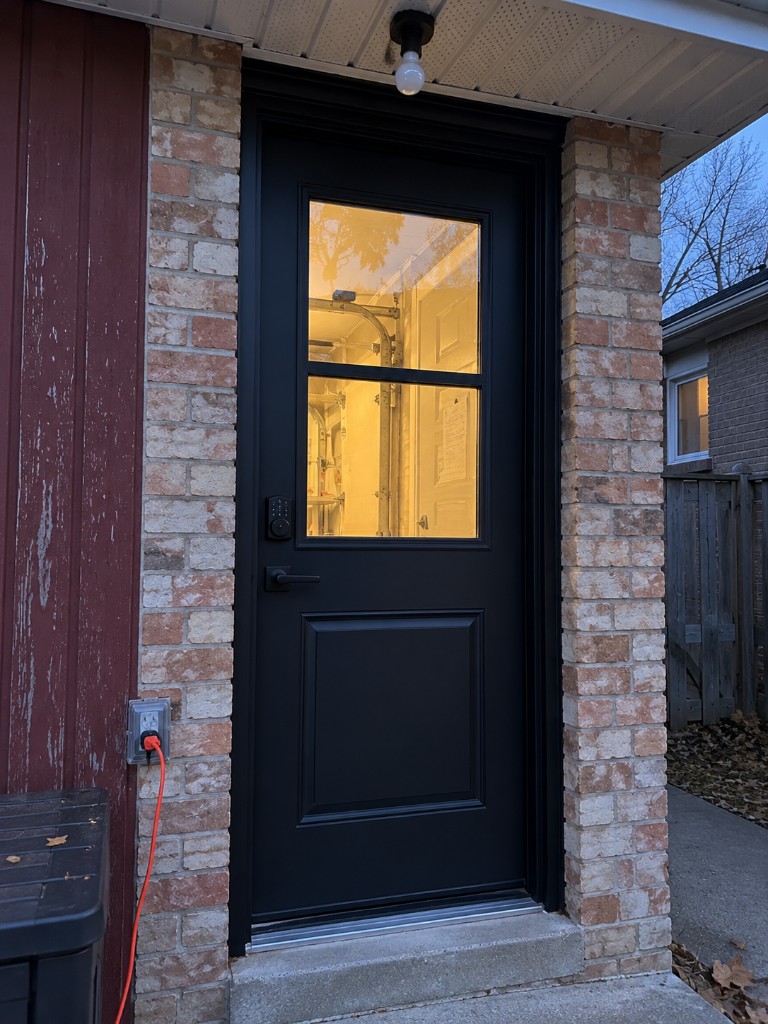 Entry door with divided glass lites